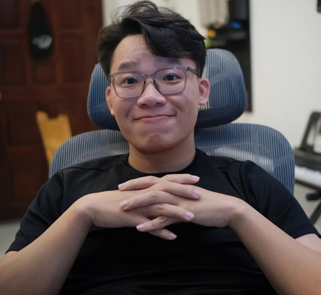 Professional podcast producer, Asian man smiling confidently